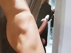 handjob - A naked man gets jerked in a fitting room